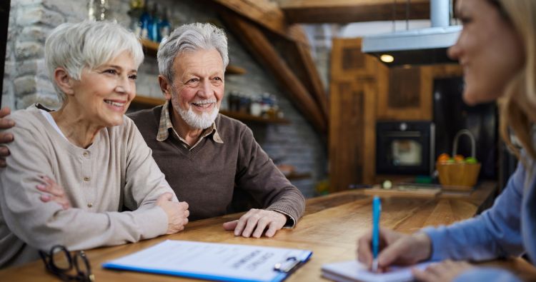 A retired couple discuss end-of-life plans with financial professional