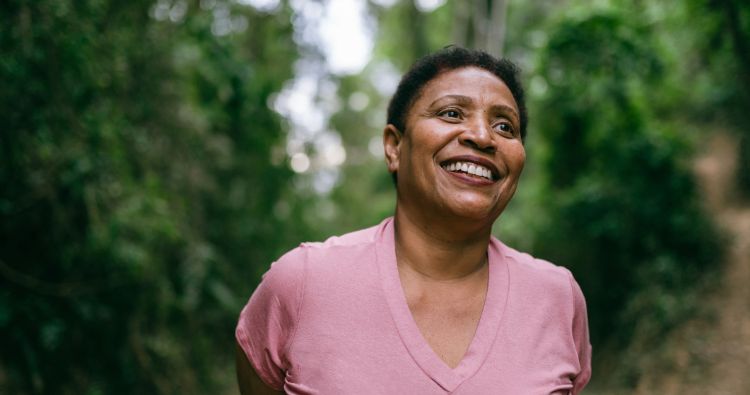 A woman walks in the woods together