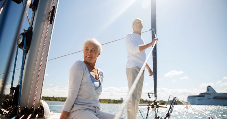 A retired couple sail on their boat