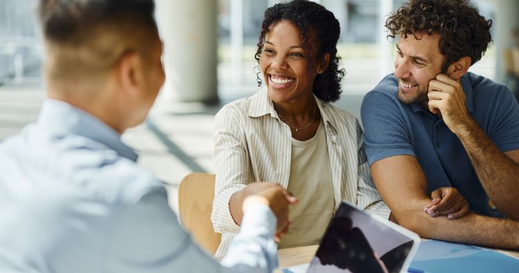 A young woman meets with her financial professional.