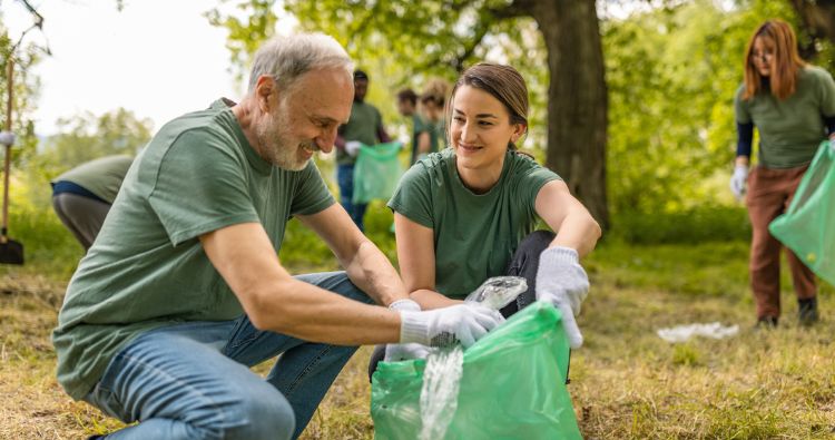 retired senior male volunteering cleaning up trash