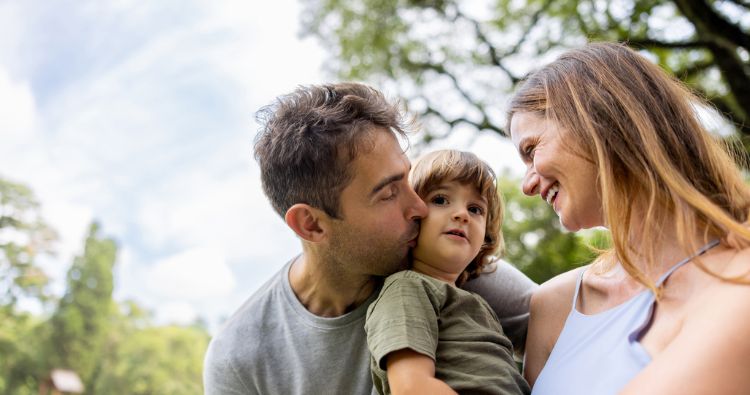 A family take a walk int he park.
